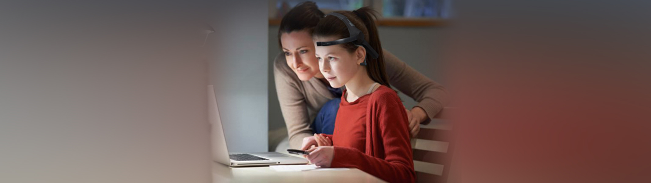 Child studying with parent wearing eeg headset