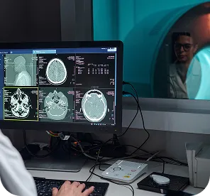 Research workstation displaying brain imagery to represent EEG data visualization and analysis
