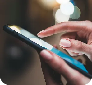 Hand using smartphone representing EEG data connectivity and mobile integration