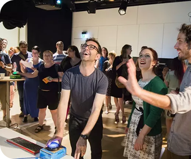 Attendees engaging in a brainwave-controlled interactive game experience